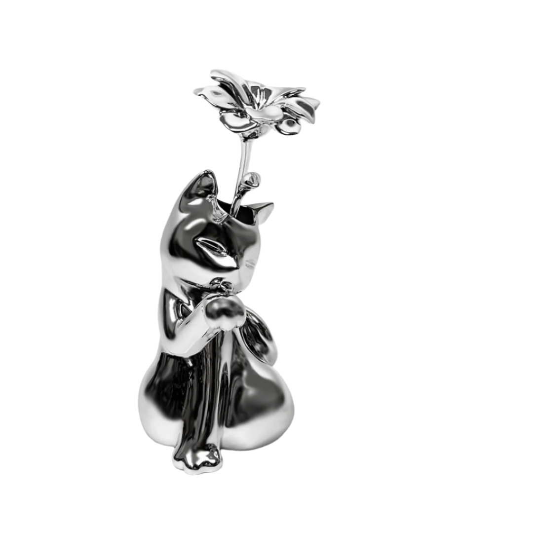Futuristic chrome cat vase with sleek sculptural curves – metallic finish with abstracted lucky cat silhouette and hollowed floral opening