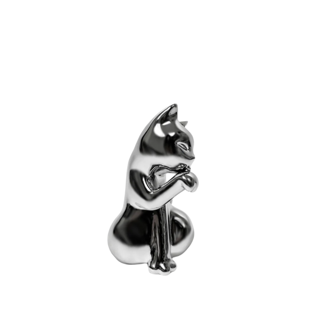 Futuristic chrome sliver cat vase with sleek sculptural curves – metallic finish with abstracted lucky cat silhouette and hollowed floral opening