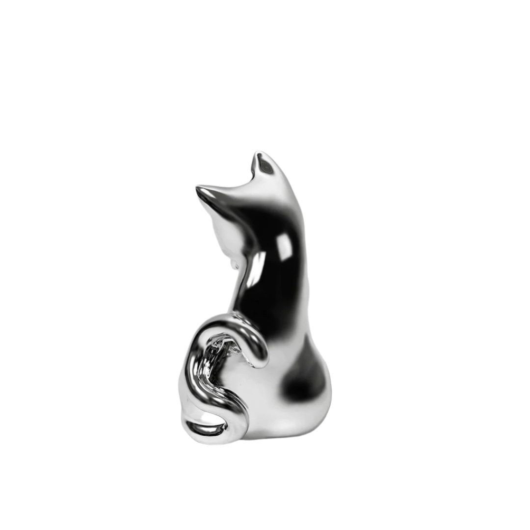 Futuristic chrome cat vase with sleek sculptural curves – metallic finish with abstracted lucky cat silhouette and hollowed floral opening