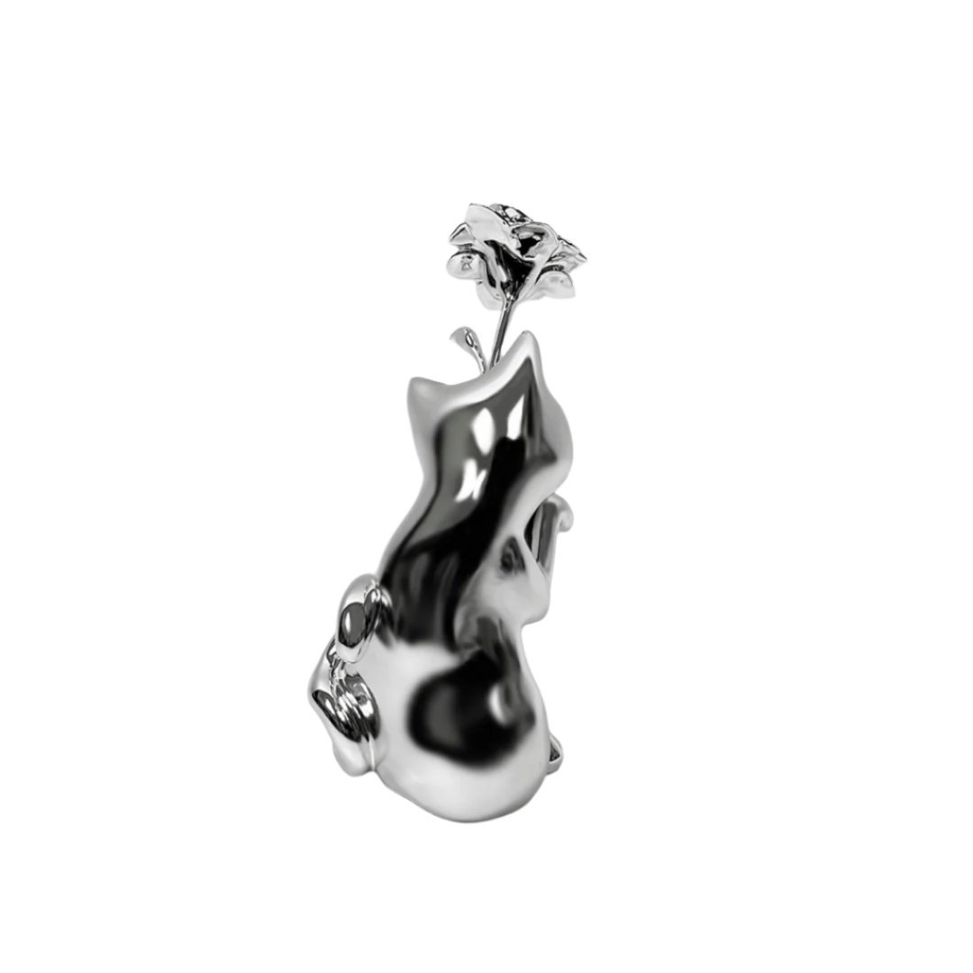 Futuristic chrome cat vase with sleek sculptural curves – metallic finish with abstracted lucky cat silhouette and hollowed floral opening