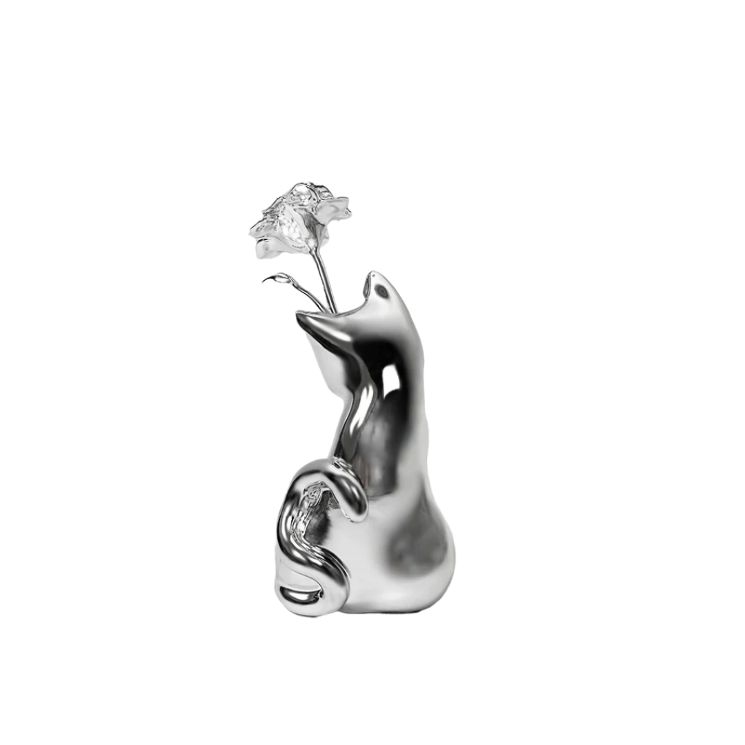 Futuristic chrome cat vase with sleek sculptural curves – metallic finish with abstracted lucky cat silhouette and hollowed floral opening