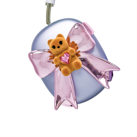 Pink bow AirPods Max cover featuring a beige bear holding a pink crystal heart, part of the Magic Bear series.