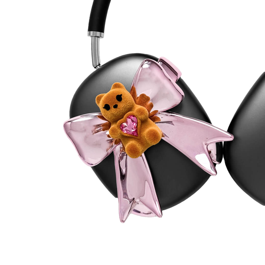 Pink bow AirPods Max cover featuring a beige bear holding a pink crystal heart, part of the Magic Bear series.