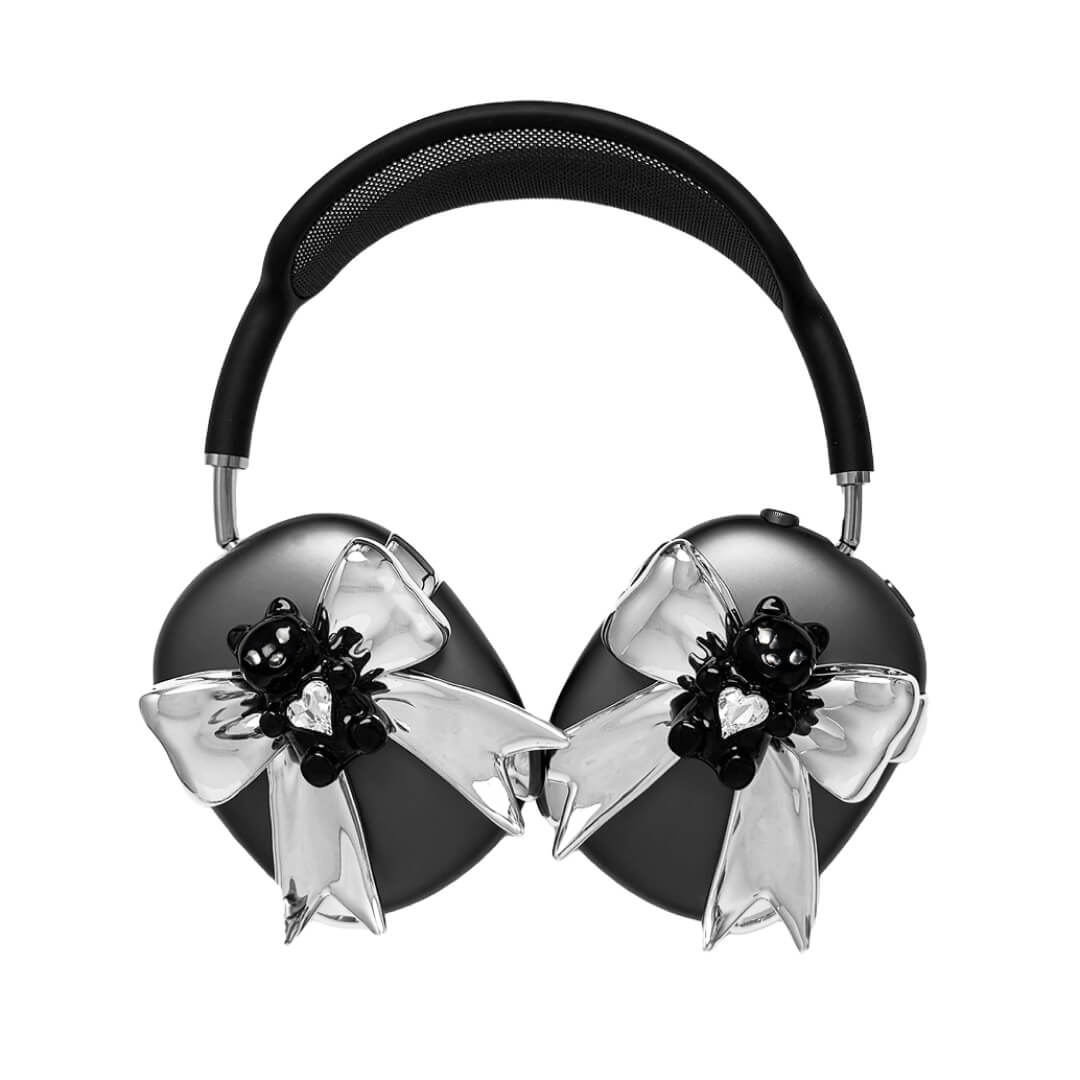 Transparent mirror phone case with a 3D teddy bear in brown flocking, wearing a black bow tie.