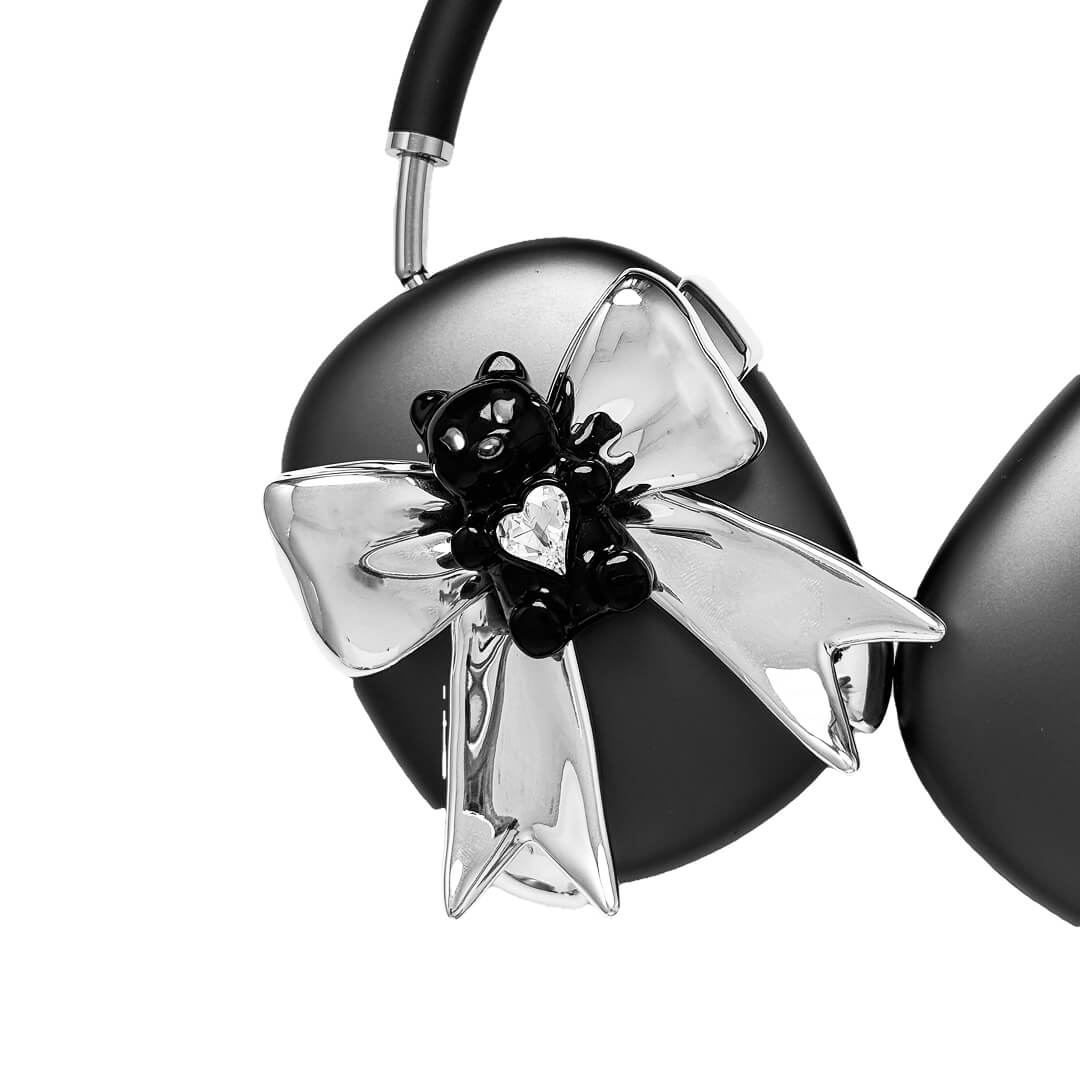 Transparent mirror phone case with a 3D teddy bear in brown flocking, wearing a black bow tie.