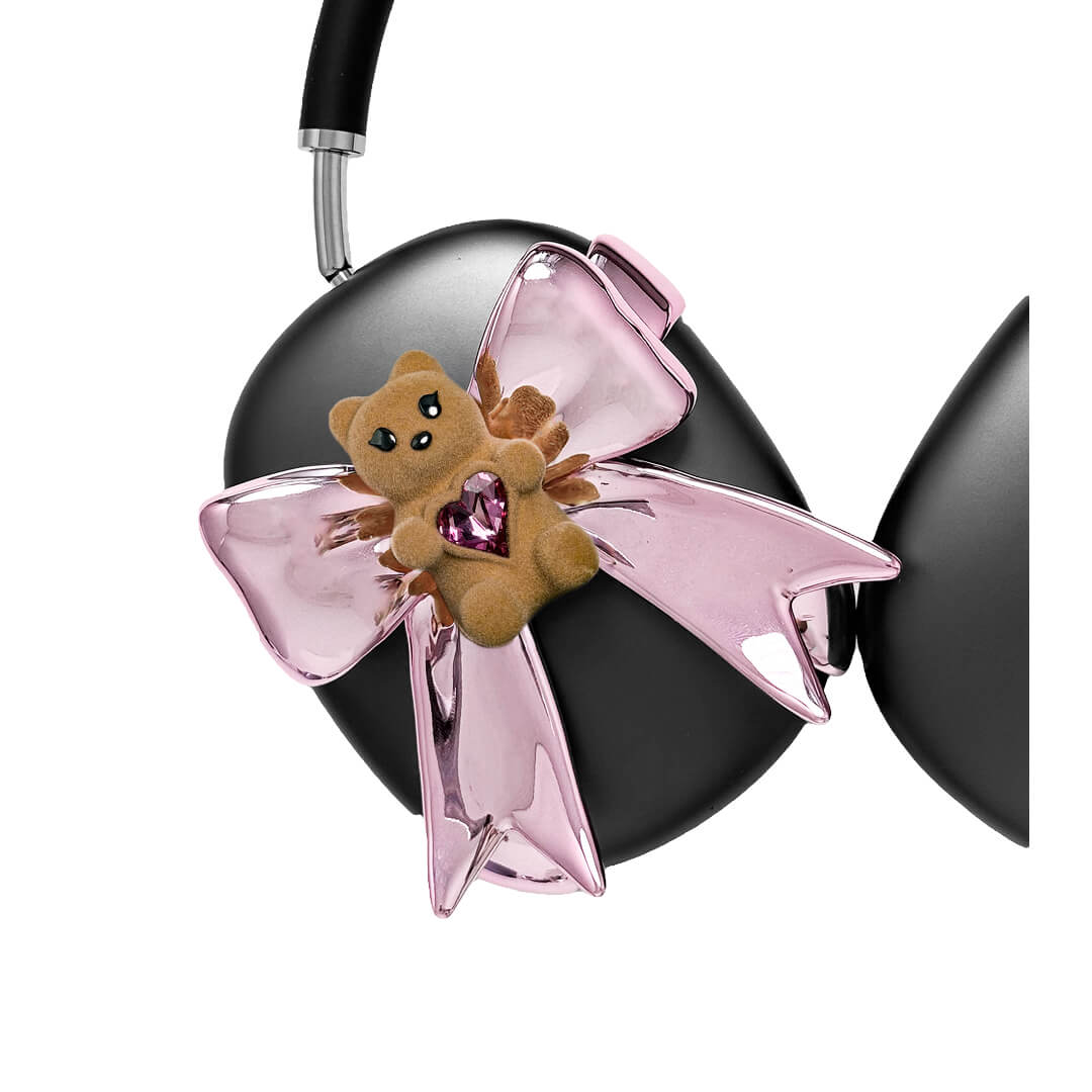 Pink bow AirPods Max cover featuring a beige bear holding a pink crystal heart, part of the Magic Bear series.