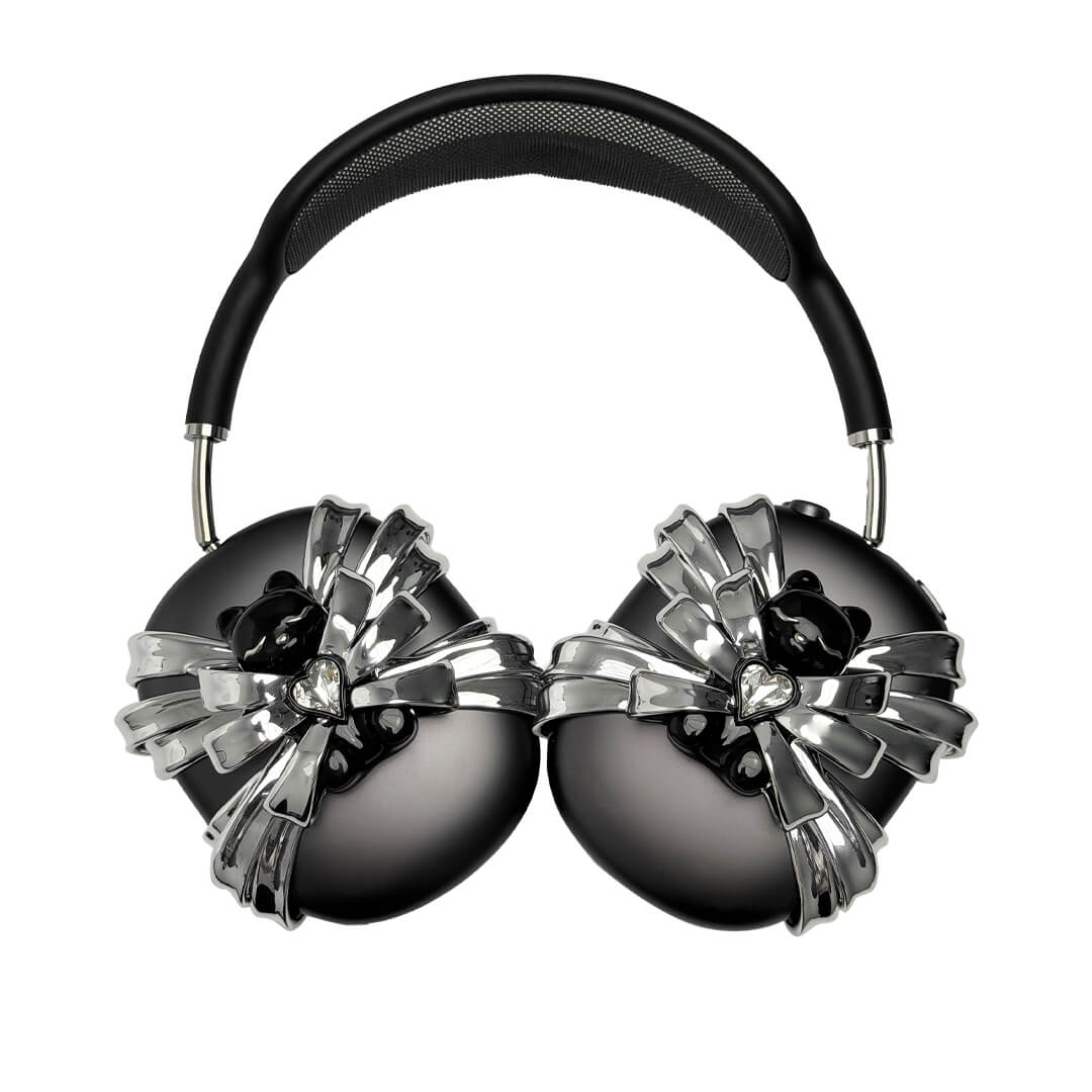 Ribbon Magic Bear AirPods Max cover featuring a glossy black bear holding a crystal heart, surrounded by layered metallic silver ribbons.