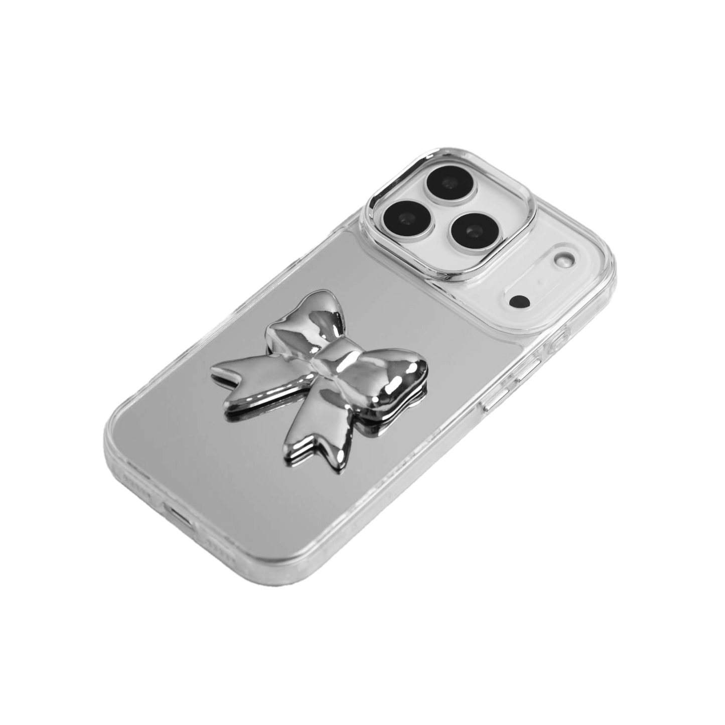 A collection of four black iPhone cases, each adorned with a distinct silver 3D metal emblem: a prominent bow tie, a sleek circular stud, an intricate spider, and a stylized four-point cross.