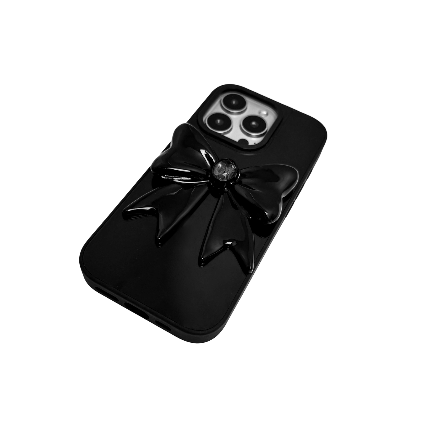 Midnight Gem Bow iPhone Case with 3D bow design, available in mirror silver and glossy black. Swarovski crystal centerpiece offered in black, white, or pink.