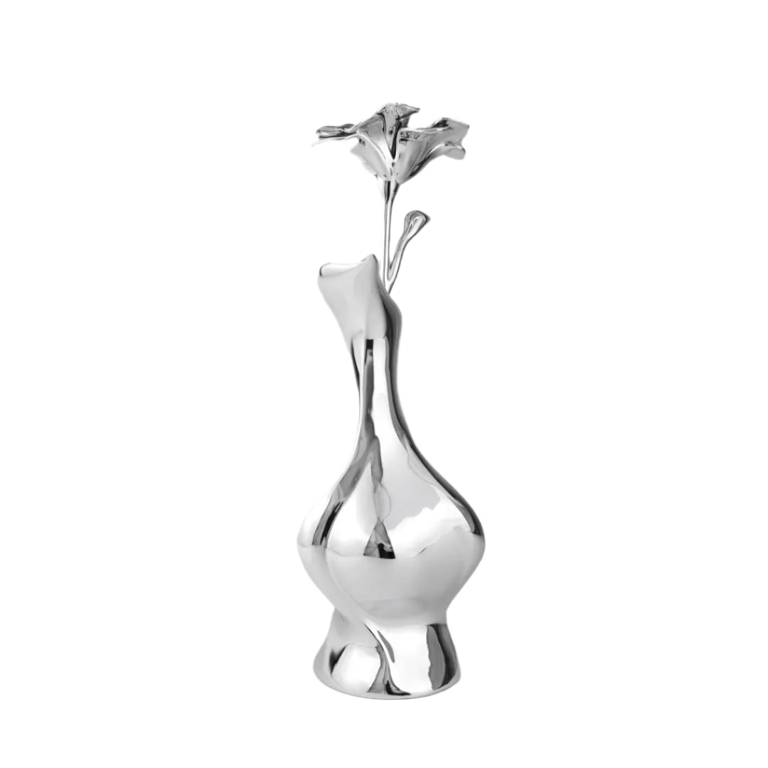 Futuristic chrome vase with fluid sculptural silhouette and blooming flower stem – high-shine metallic art object with organic elegance