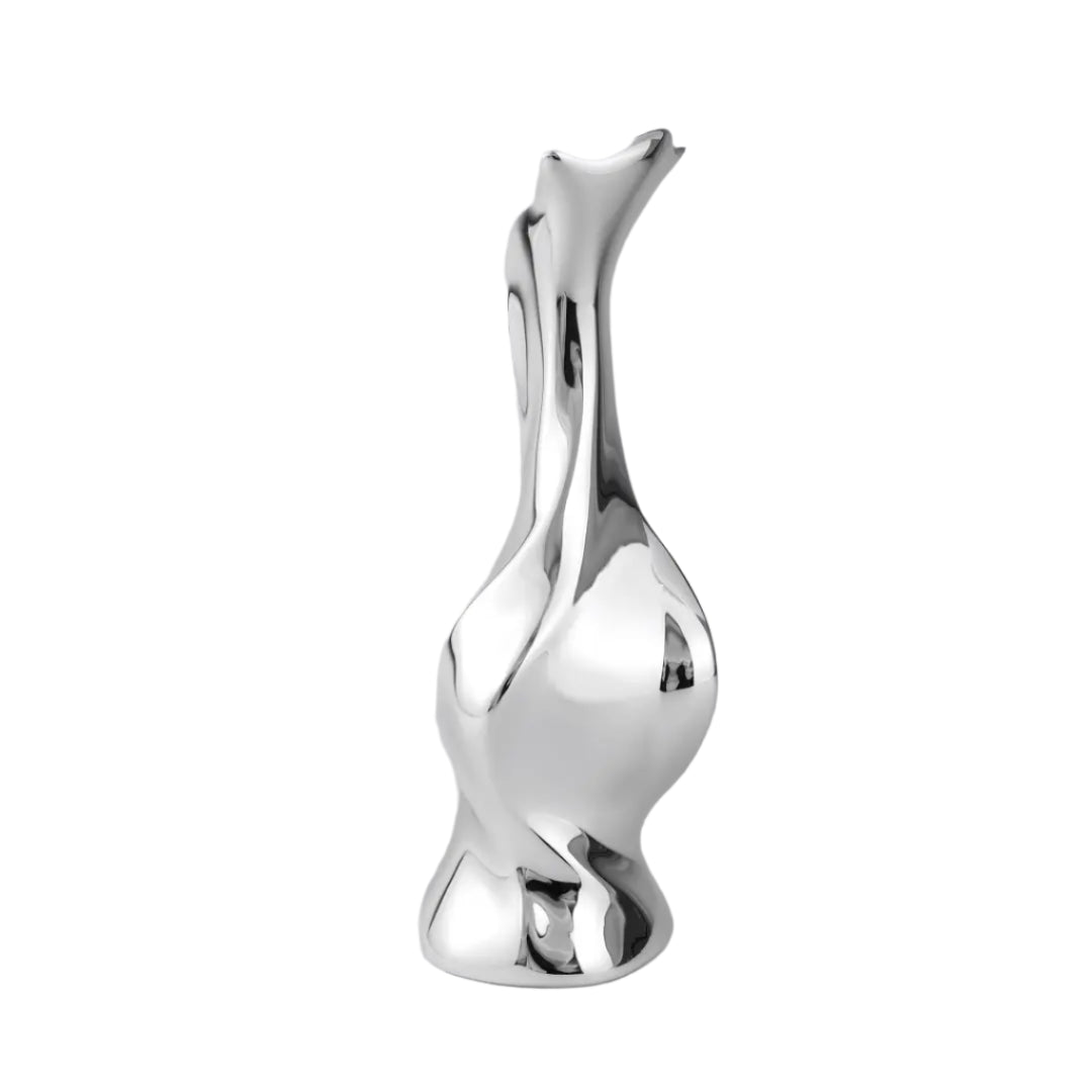 Futuristic chrome vase with fluid sculptural silhouette and blooming flower stem – high-shine metallic art object with organic elegance