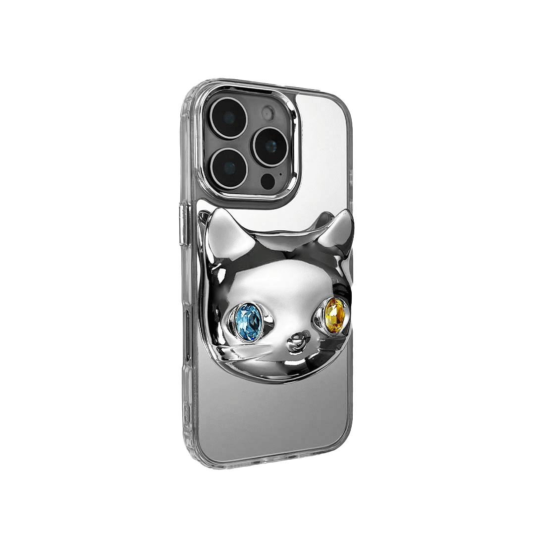 Silver mirror iPhone case with 3D cat face design, featuring mismatched gem eyes in blue and yellow — perfect for a quirky, futuristic feline aesthetic.