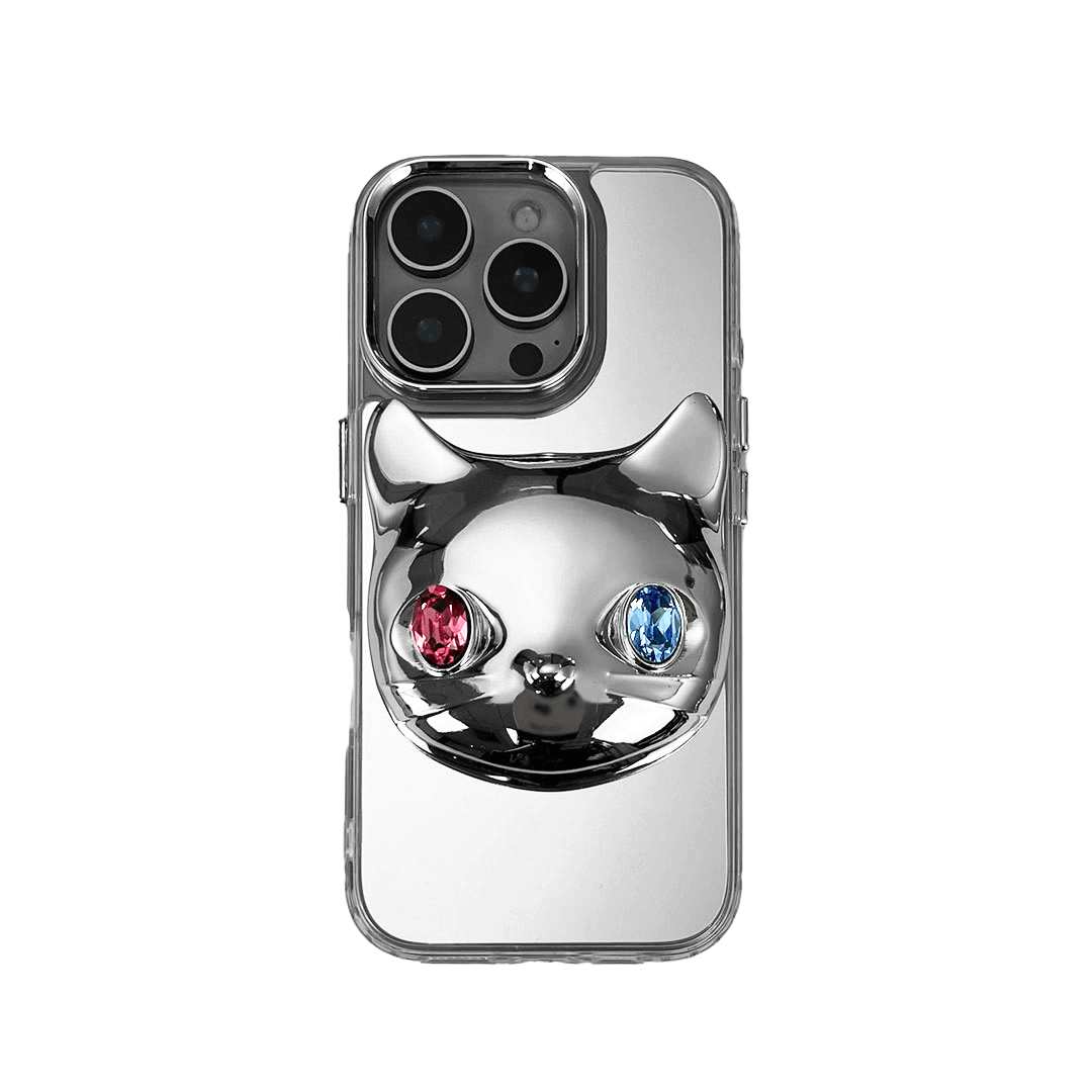 Silver mirror iPhone case with 3D cat face design, featuring mismatched gem eyes in blue and yellow — perfect for a quirky, futuristic feline aesthetic.