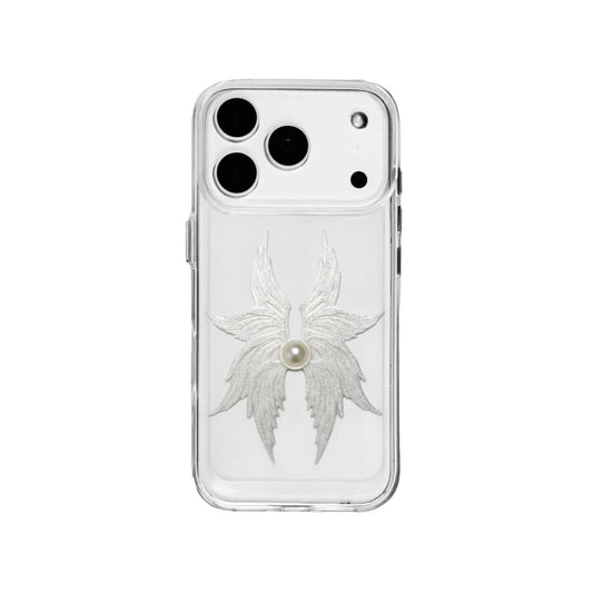 The Embroidered Angel Wings iPhone Case featuring intricate white feather/wing embroidery and a central pearl, shown on both the Crystal Clear (Transparent) and White Leather Texture base options.