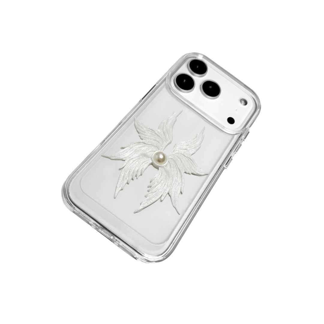 The Embroidered Angel Wings iPhone Case featuring intricate white feather/wing embroidery and a central pearl, shown on both the Crystal Clear (Transparent) and White Leather Texture base options.