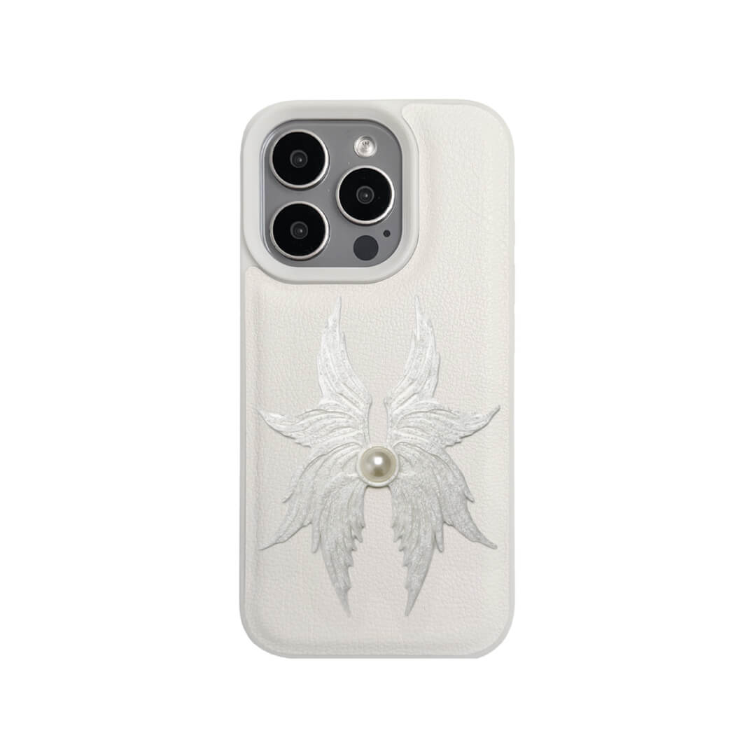 The Embroidered Angel Wings iPhone Case featuring intricate white feather/wing embroidery and a central pearl, shown on both the Crystal Clear (Transparent) and White Leather Texture base options.