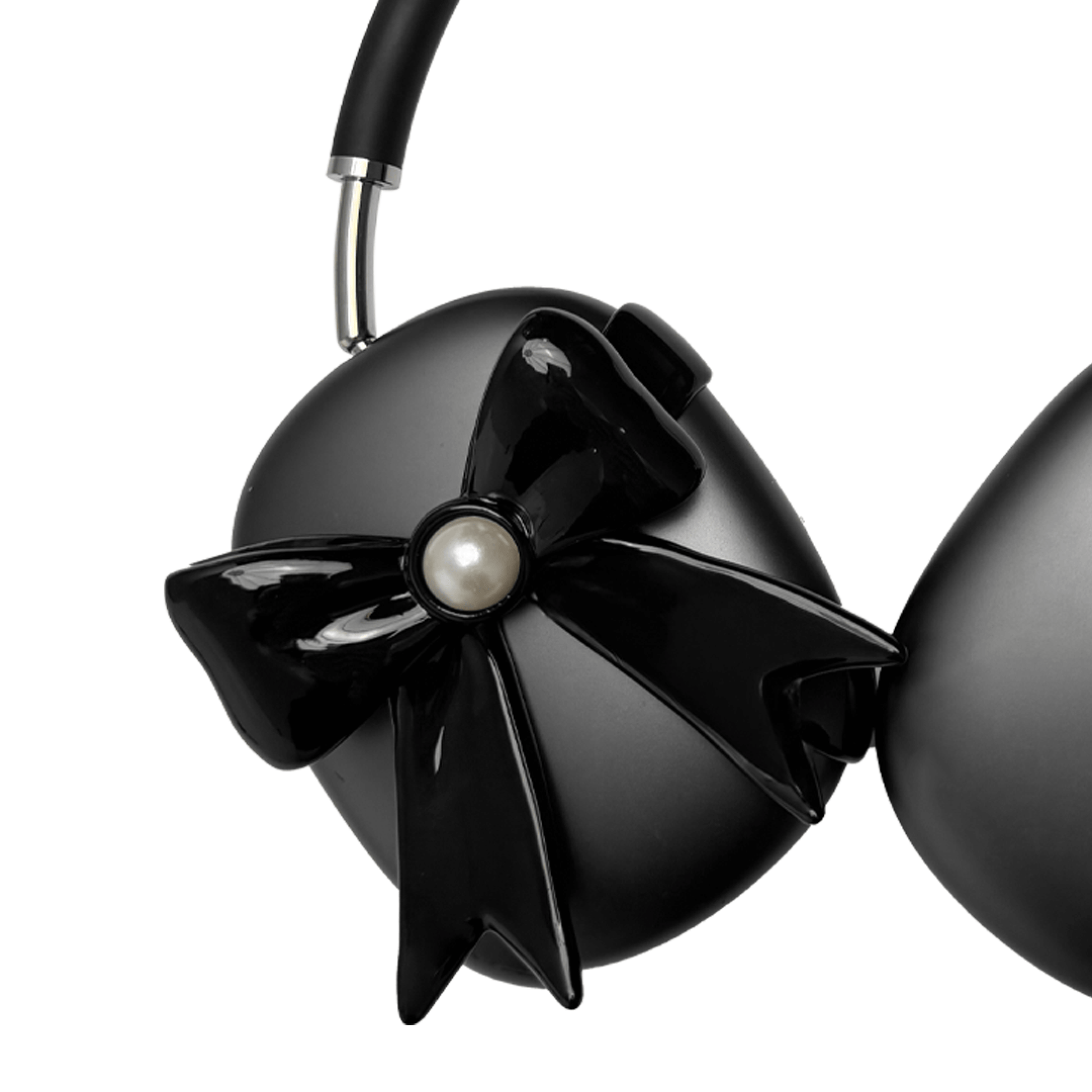 A pair of protective covers for the AirPods Max headphones, featuring a large, 3D bow charm on each ear cup cover. One set is matte black with black bows, and the other is metallic silver with white bows. A white pearl is centered on each bow.