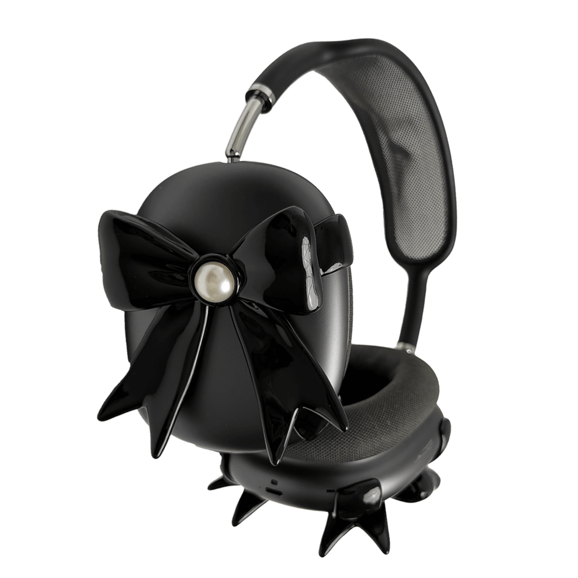 A pair of protective covers for the AirPods Max headphones, featuring a large, 3D bow charm on each ear cup cover. One set is matte black with black bows, and the other is metallic silver with white bows. A white pearl is centered on each bow.