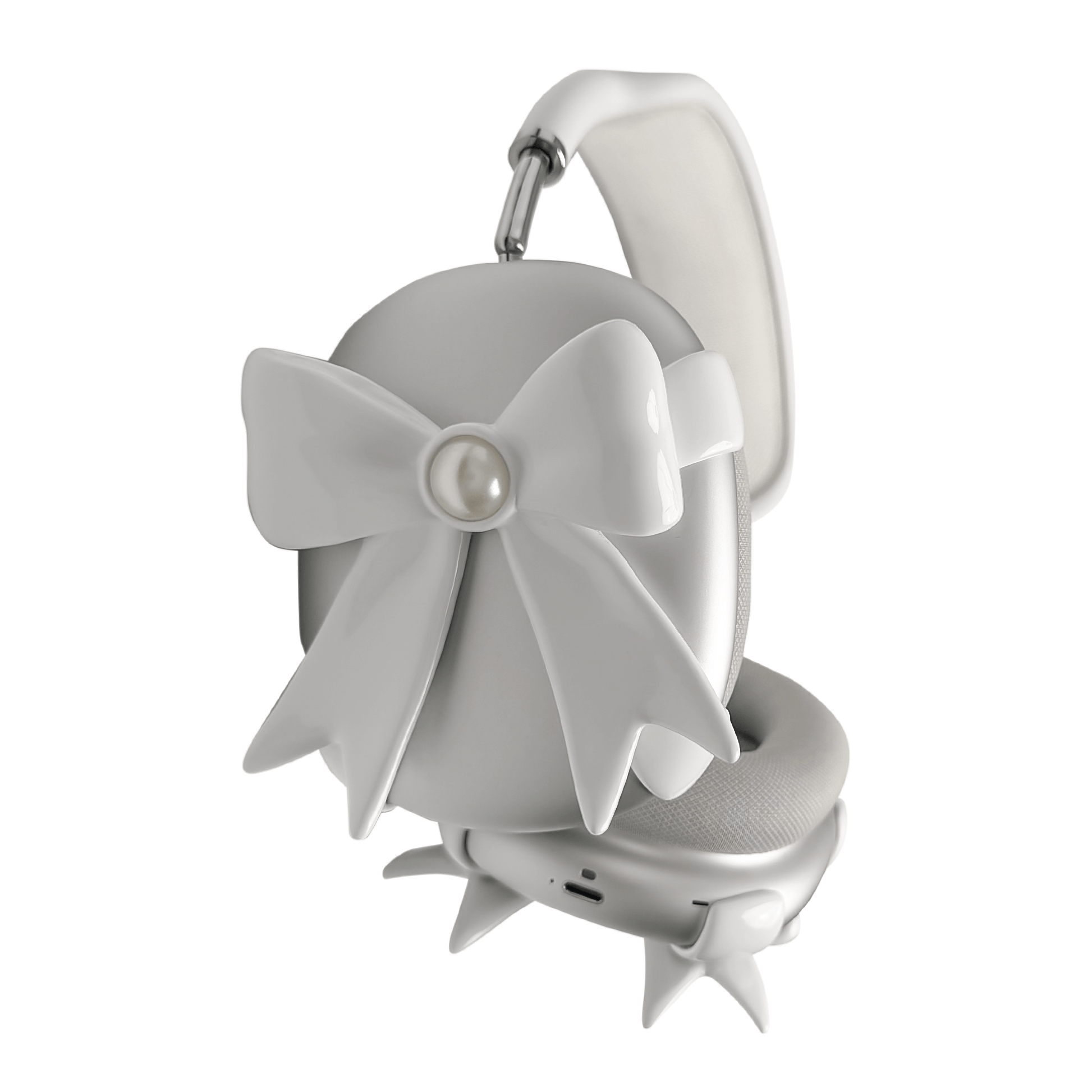 A pair of protective covers for the AirPods Max headphones, featuring a large, 3D bow charm on each ear cup cover. One set is matte black with black bows, and the other is metallic silver with white bows. A white pearl is centered on each bow.