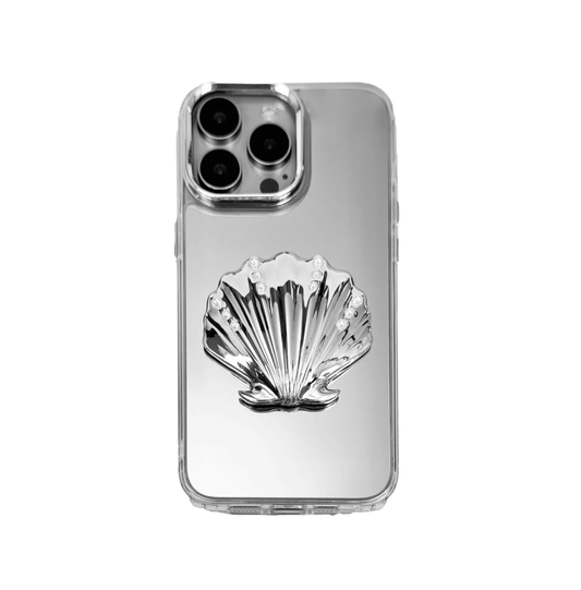 Matte phone case with a raised scallop shell design adorned with small pearl-like dots.