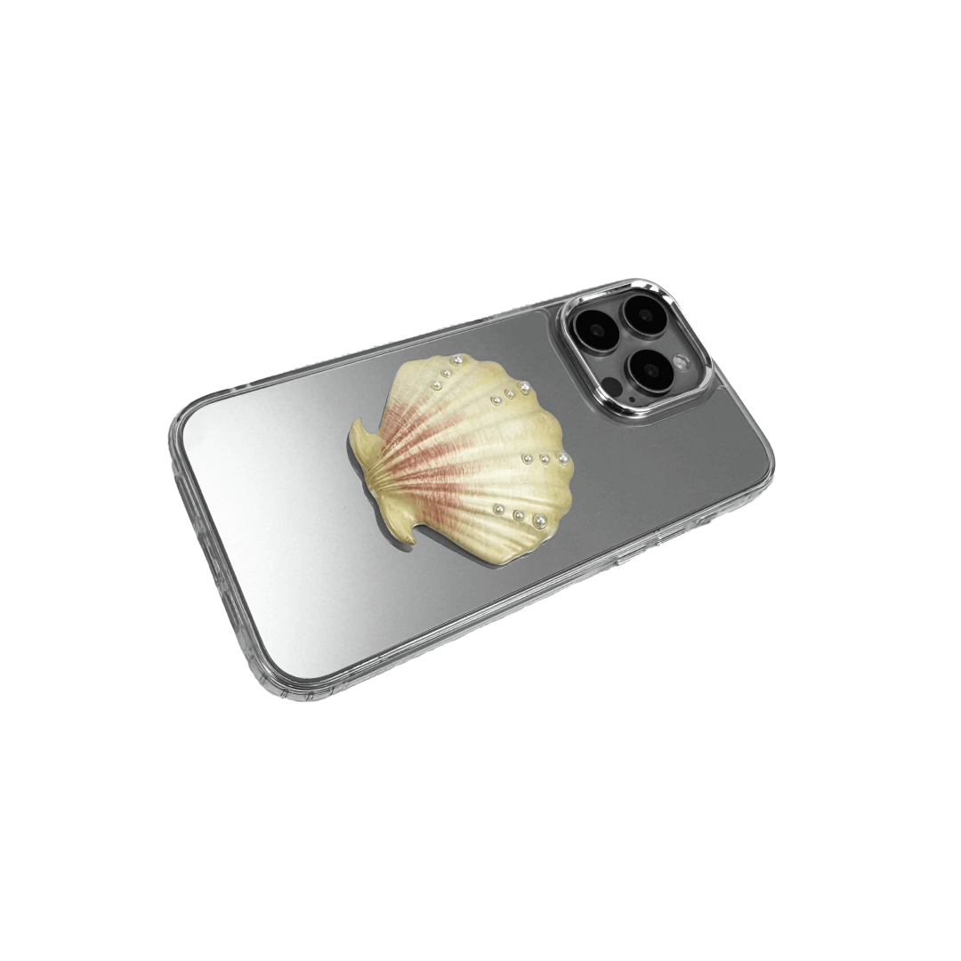Matte phone case with a raised scallop shell design adorned with small pearl-like dots.