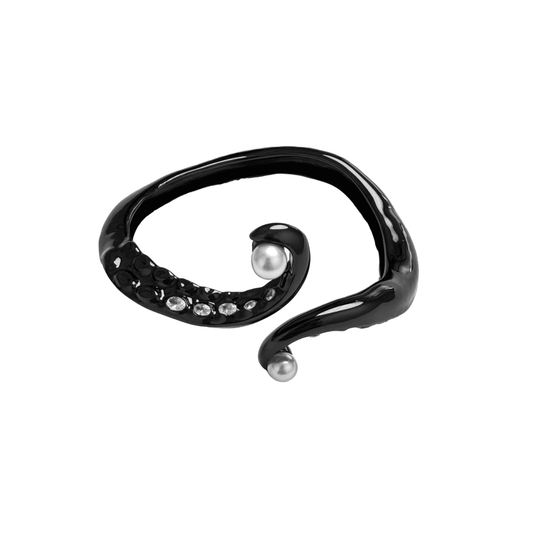 Black and silver octopus-inspired bracelet with pearl detail.