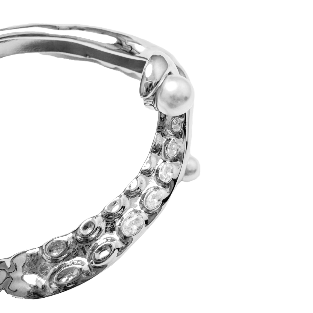 Black and silver octopus-inspired bracelet with pearl detail.