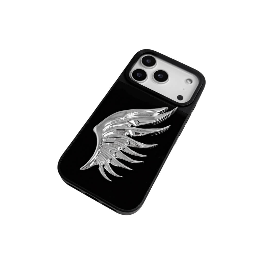 The Sculpted Silver Feather iPhone Case featuring a single 3D metallic feather with an intricate texture and high-shine chrome finish. Shown in three base variations: Silver, Transparent, and Black.