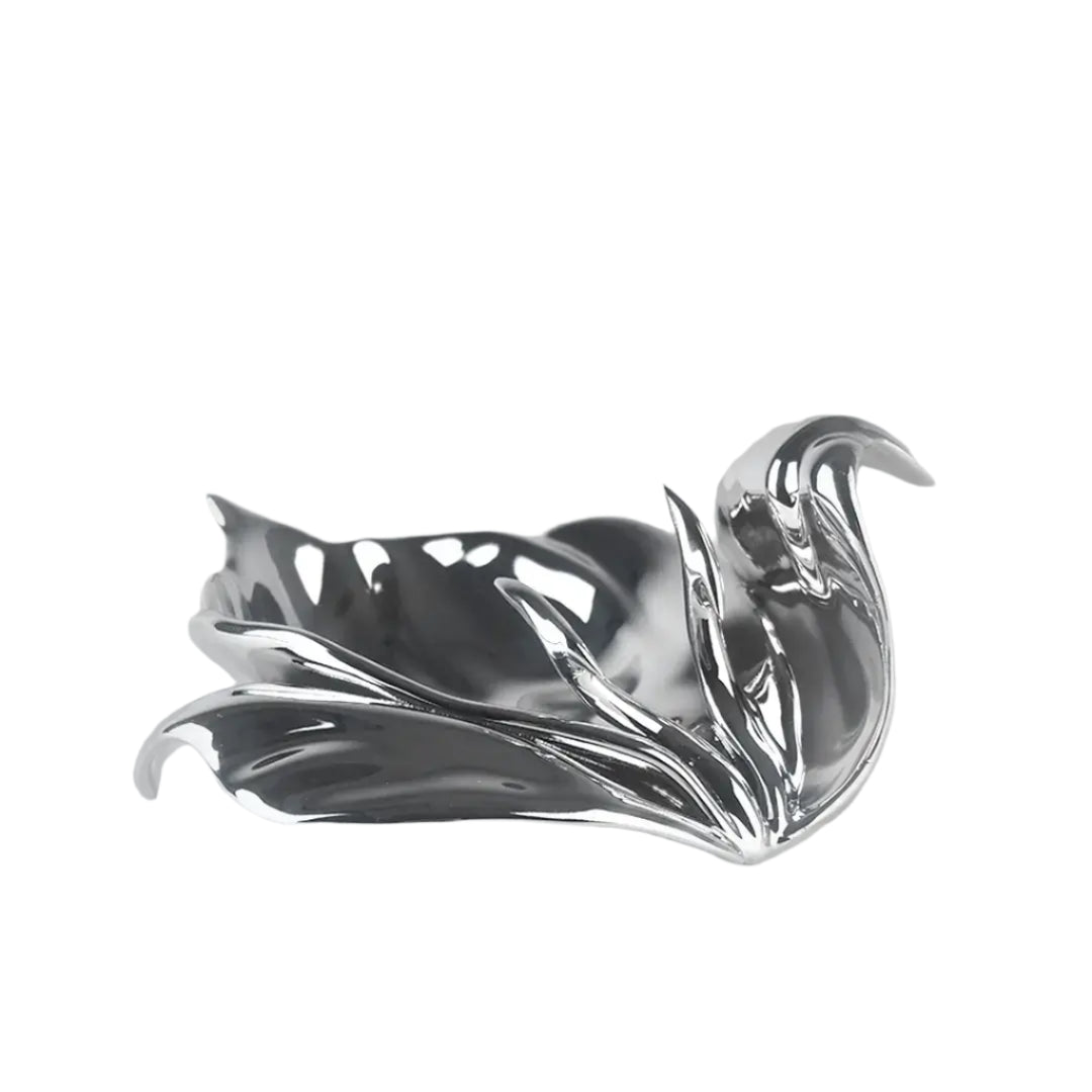 Futuristic chrome incense holder with flowing petal silhouette – organic metallic design cradling incense stick in sculptural bloom