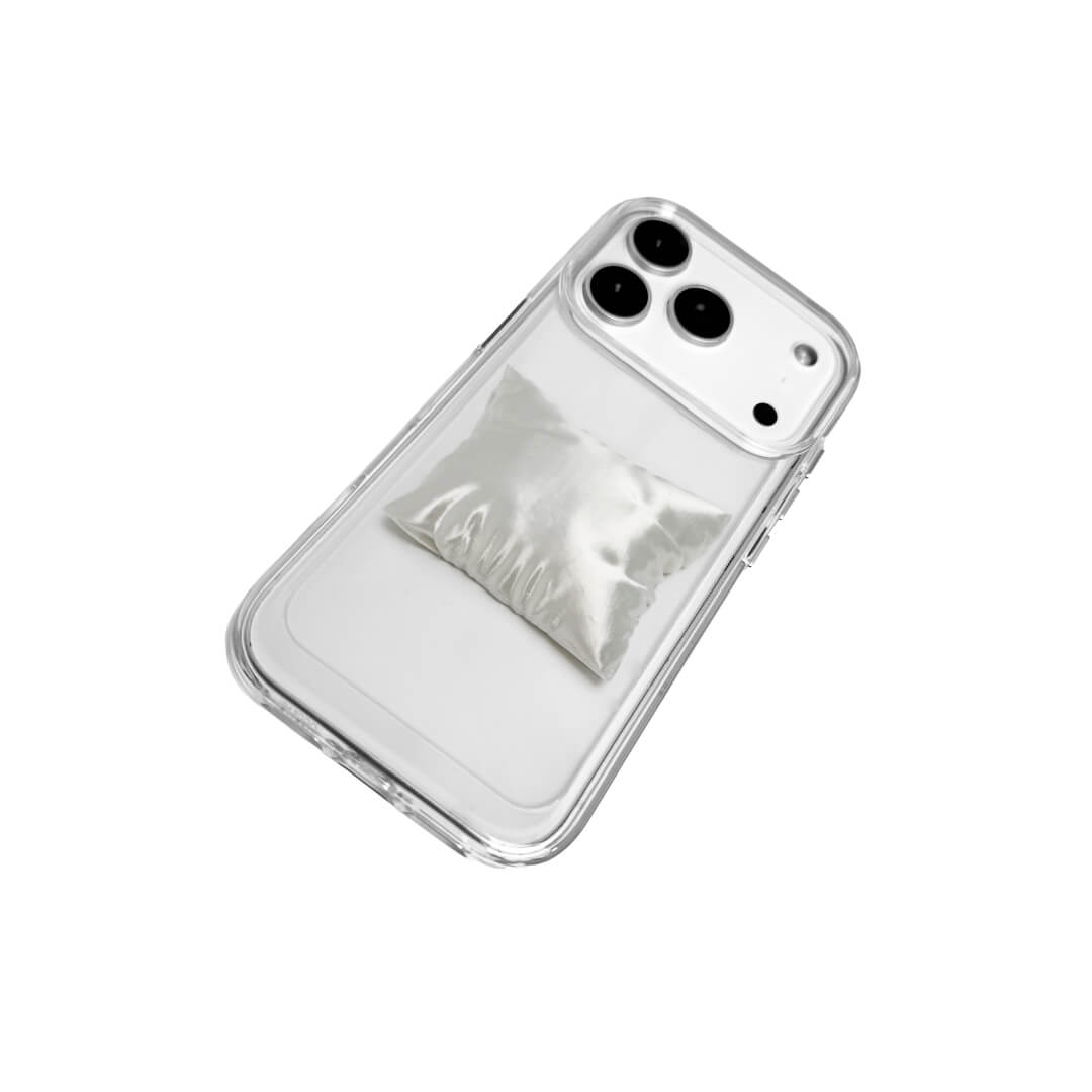 Two Pillow iPhone Cases: one with a transparent case and one with a white lychee leather case. Both feature the 3D sculpted silver/white pillow detail.