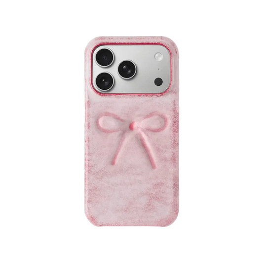 Pink phone case with a bow design on a white background