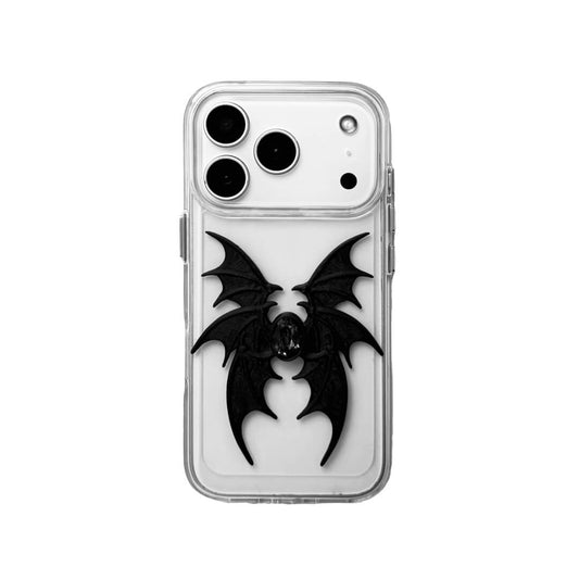 A high-concept iPhone case featuring a 3D-printed quad-wing demon design in a natural matte black finish, centered with a sparkling black Swarovski crystal. The design is shown on a Clear Transparent base and a Black Litchi Leather textured base, highlighting the intricate, layered skeletal wing structure and the dark gemstone detail.