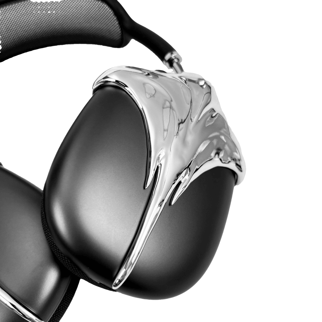 Futuristic headphones featuring a sculpted metallic stingray design with flowing, aerodynamic wings and a sharp central tail motif.
