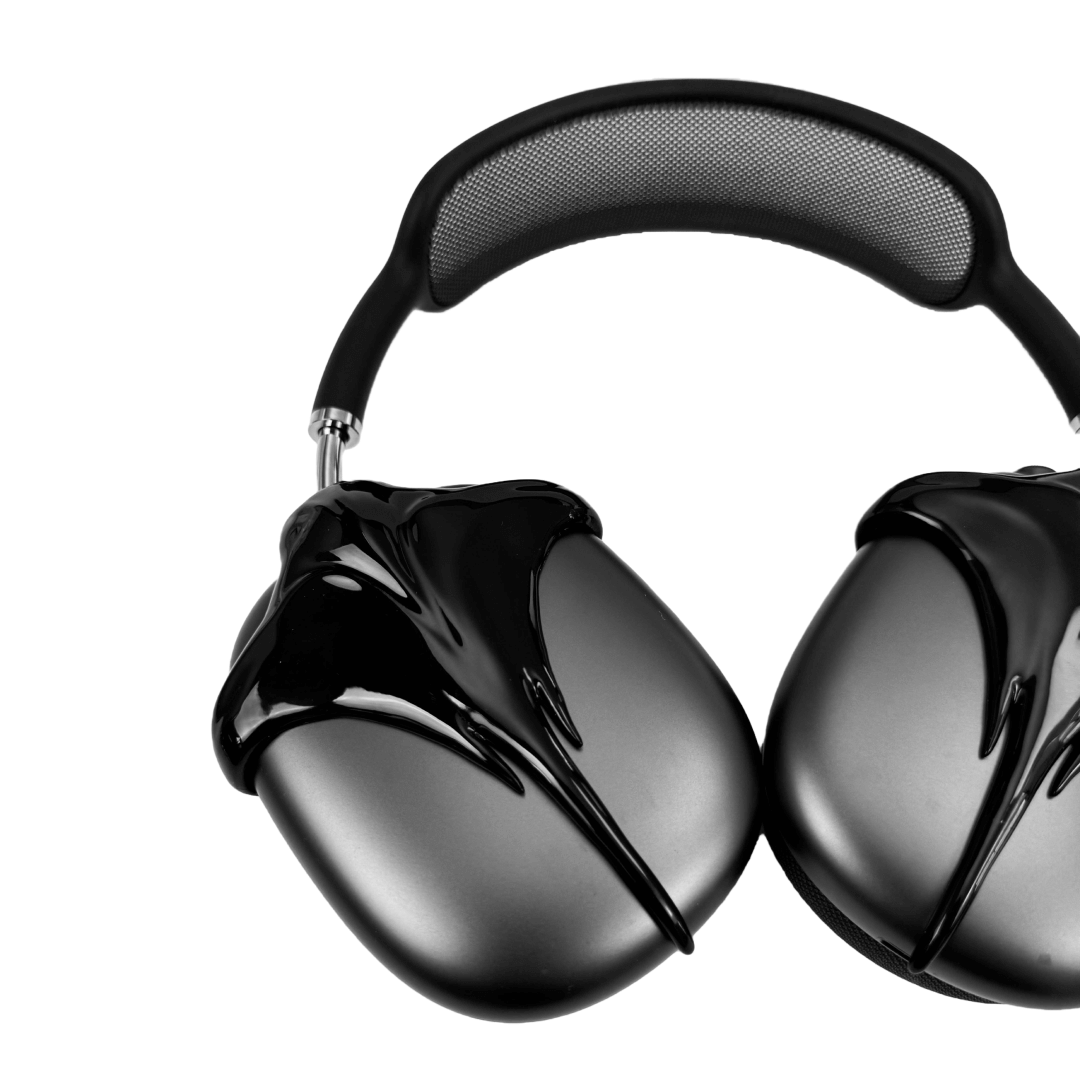 Futuristic headphones featuring a sculpted metallic stingray design with flowing, aerodynamic wings and a sharp central tail motif.