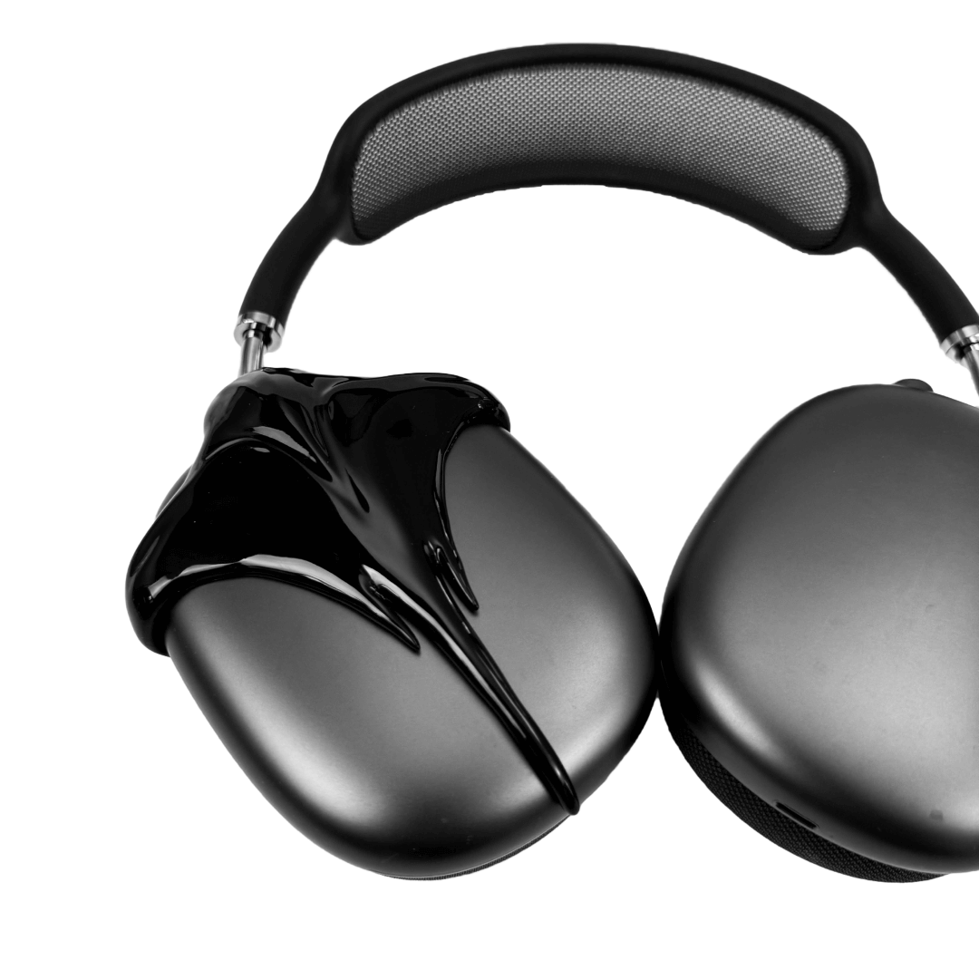 Futuristic headphones featuring a sculpted metallic stingray design with flowing, aerodynamic wings and a sharp central tail motif.