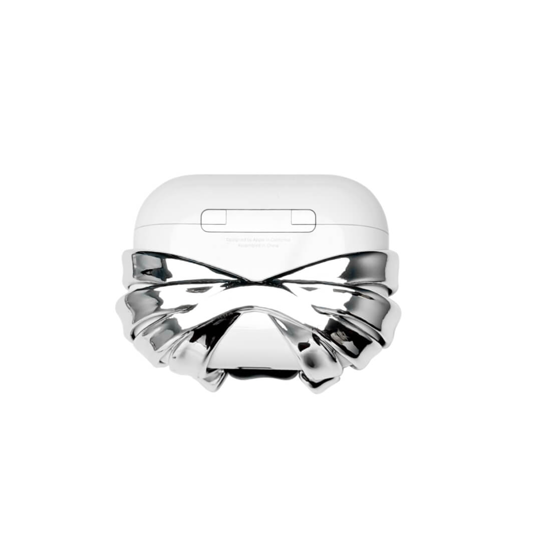 Silver ribbon AirPods cover with a black bear charm and heart centerpiece