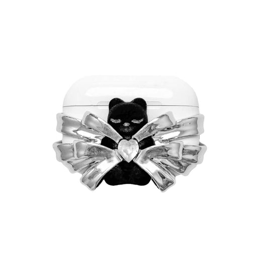 Silver ribbon AirPods cover with a black bear charm and heart centerpiece