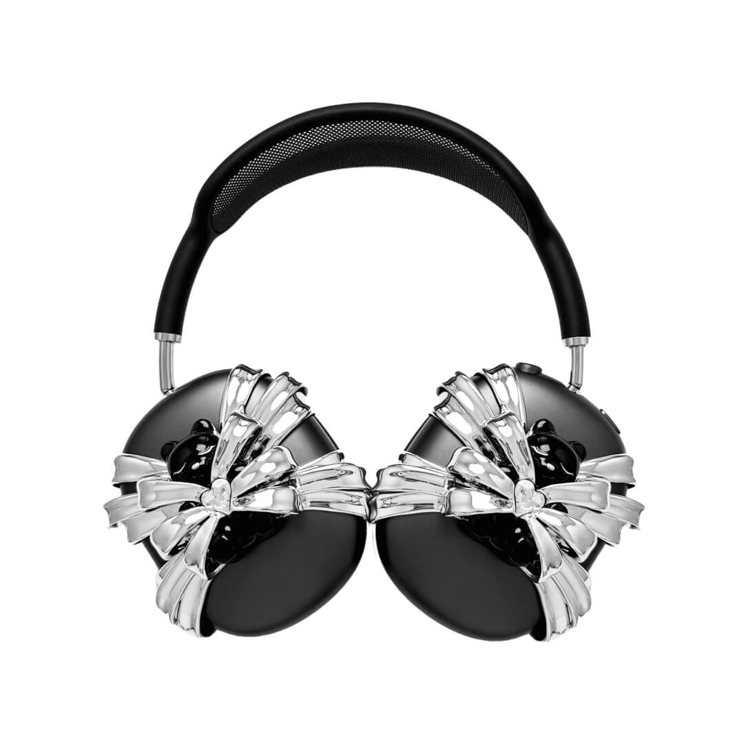 Ribbon Magic Bear AirPods Max cover featuring a glossy black bear holding a crystal heart, surrounded by layered metallic silver ribbons.