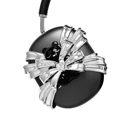 Ribbon Magic Bear AirPods Max cover featuring a glossy black bear holding a crystal heart, surrounded by layered metallic silver ribbons.