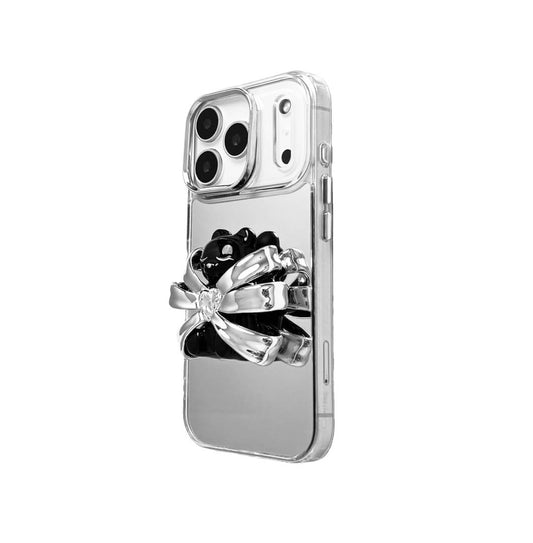 Ribbon Magic Bear iPhone Case featuring a black gummy bear holding a clear crystal heart, framed by metallic silver ribbon accents.