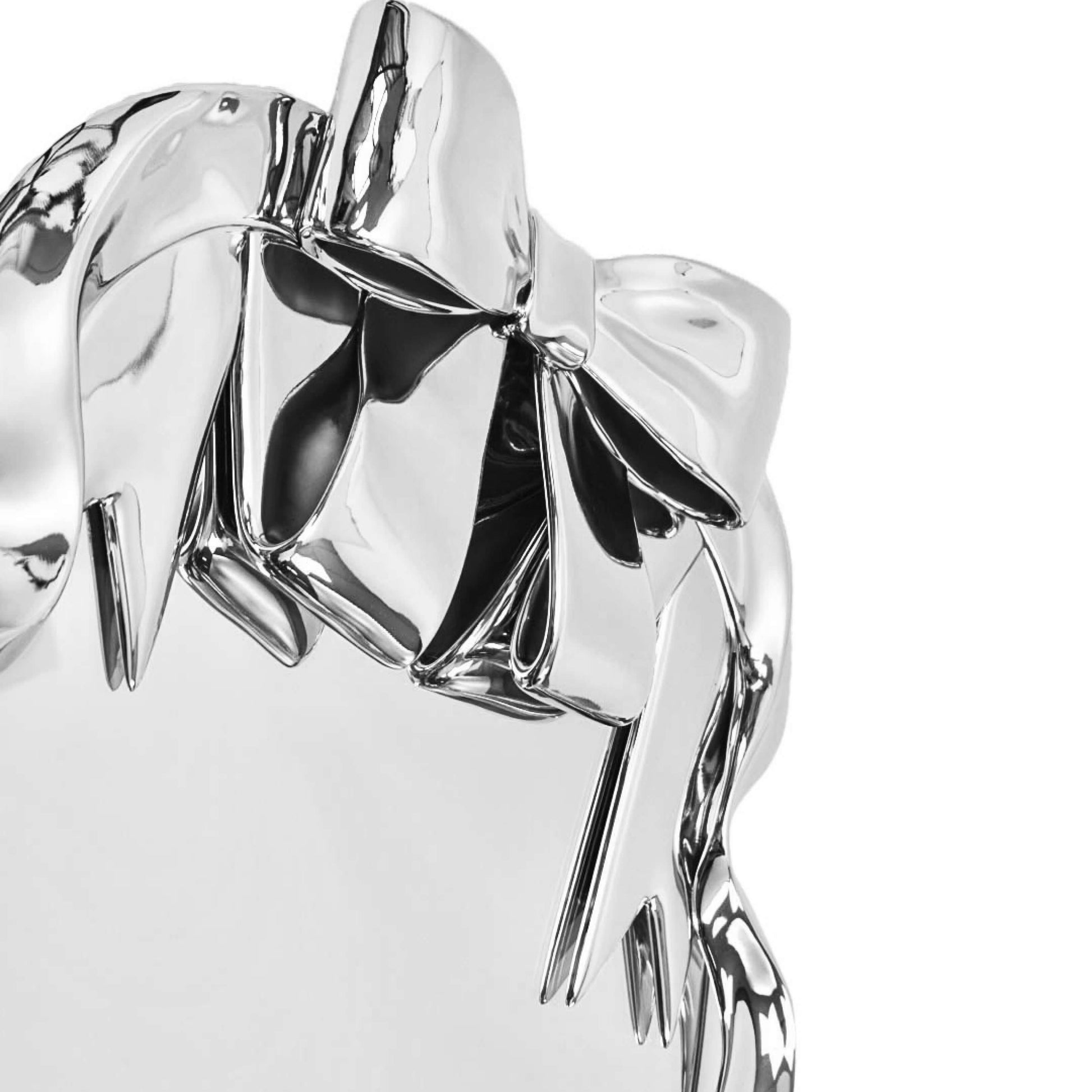 Futuristic 3D ribbon mirror in glossy pink chrome – sculptural bow-and-streamer frame surrounding an oval reflective surface with playful baroque flair