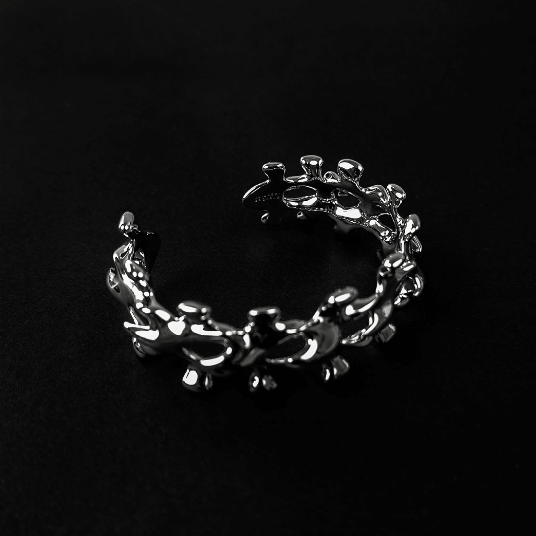 Unleash luxury elegance with the Spine Bone Bracelet. Skeletal-inspired design and oxidized finish for gothic sophistication. Perfect for unisex layering.