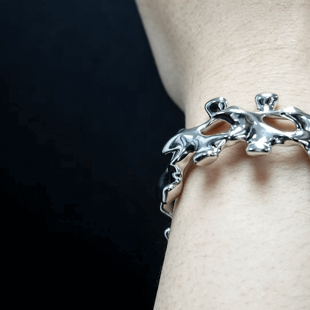 Unleash luxury elegance with the Spine Bone Bracelet. Skeletal-inspired design and oxidized finish for gothic sophistication. Perfect for unisex layering.