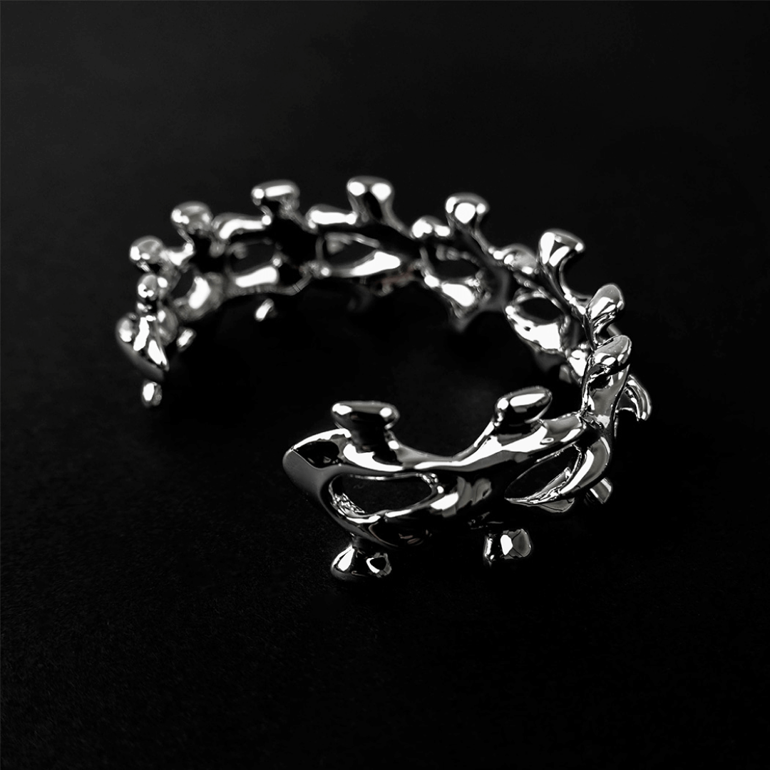 Unleash luxury elegance with the Spine Bone Bracelet. Skeletal-inspired design and oxidized finish for gothic sophistication. Perfect for unisex layering.