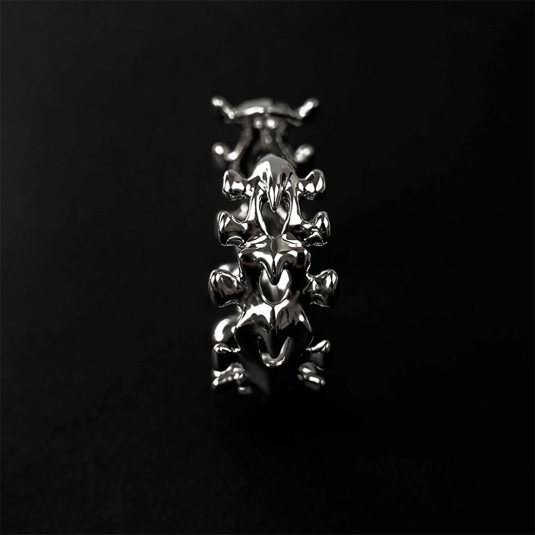 Unleash luxury elegance with the Spine Bone Bracelet. Skeletal-inspired design and oxidized finish for gothic sophistication. Perfect for unisex layering.