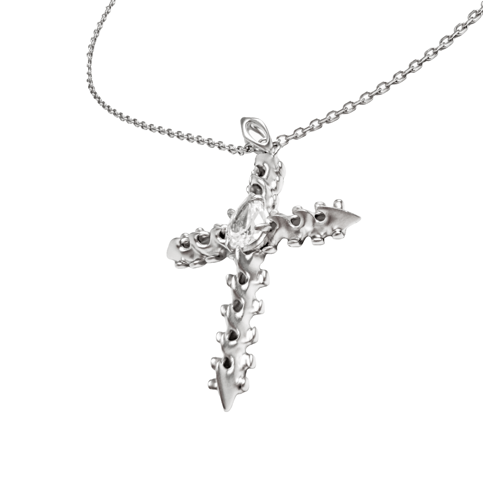 Discover the SPiNE CROSS NECKLACE, a luxurious unisex necklace featuring a distinctive skeleton-inspired cross design with diamond accents. Perfect for those seeking high-end, bold, and elegant accessories.