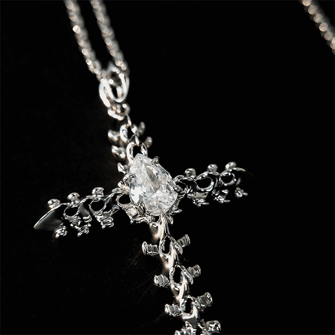 Discover the SPiNE CROSS NECKLACE, a luxurious unisex necklace featuring a distinctive skeleton-inspired cross design with diamond accents. Perfect for those seeking high-end, bold, and elegant accessories.