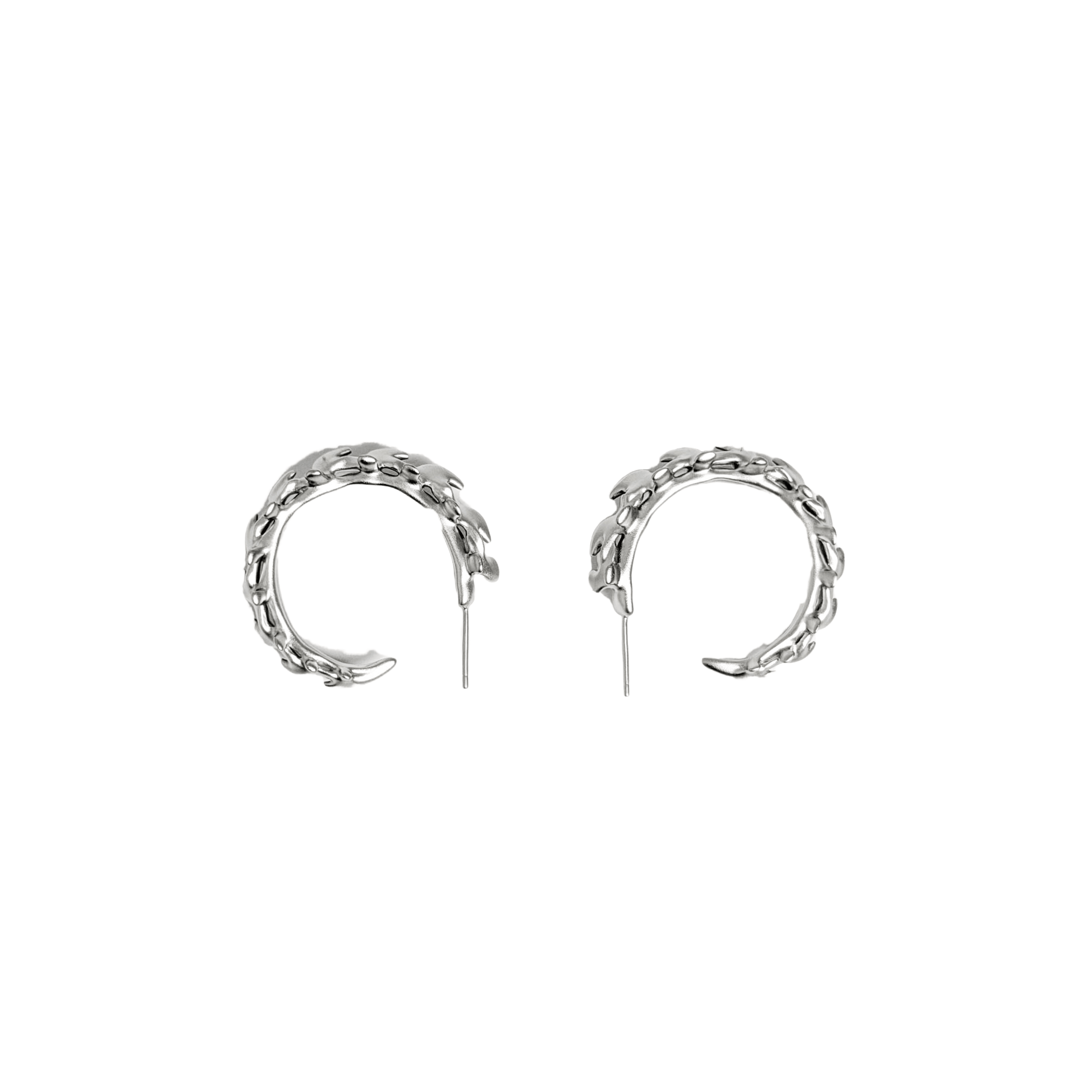 Wrap your ears in anatomical art with this luxury Spine Hoop Earrings M. Vertebra-inspired hoops for edgy stacking.