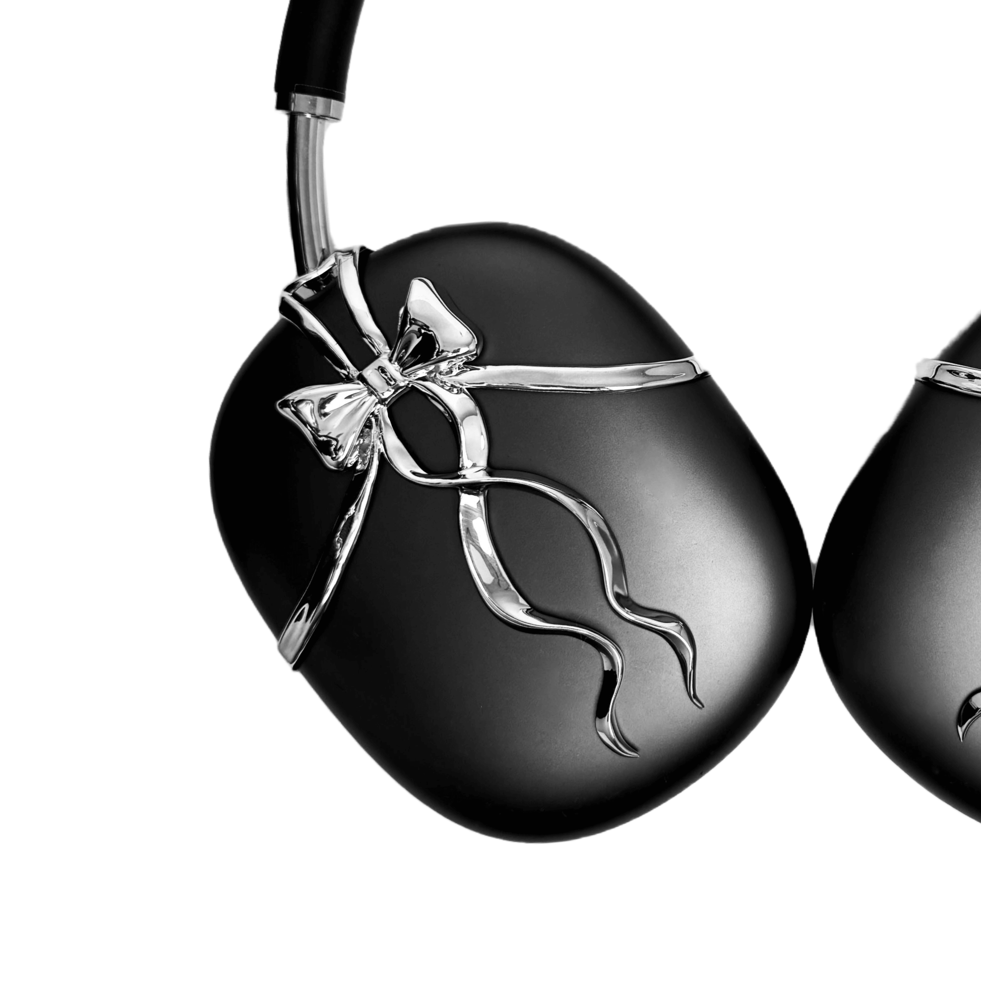 AirPods Max cover with high-polished metallic black/silver shells, featuring a flowing, monochromatic 3D ribbon design for a sophisticated, high-fashion aesthetic.