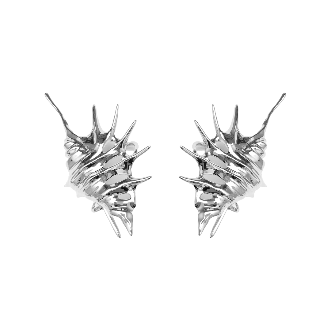 Seashell Ear Cuff — silver seashell-shaped ear cuff with smooth, flowing curves inspired by ocean waves.